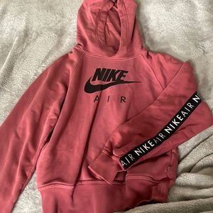Maroon Nike air sweater. Nike air writing along the arms and back.